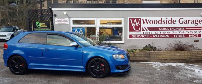 A customer's car outside Woodside Garage, New Mills