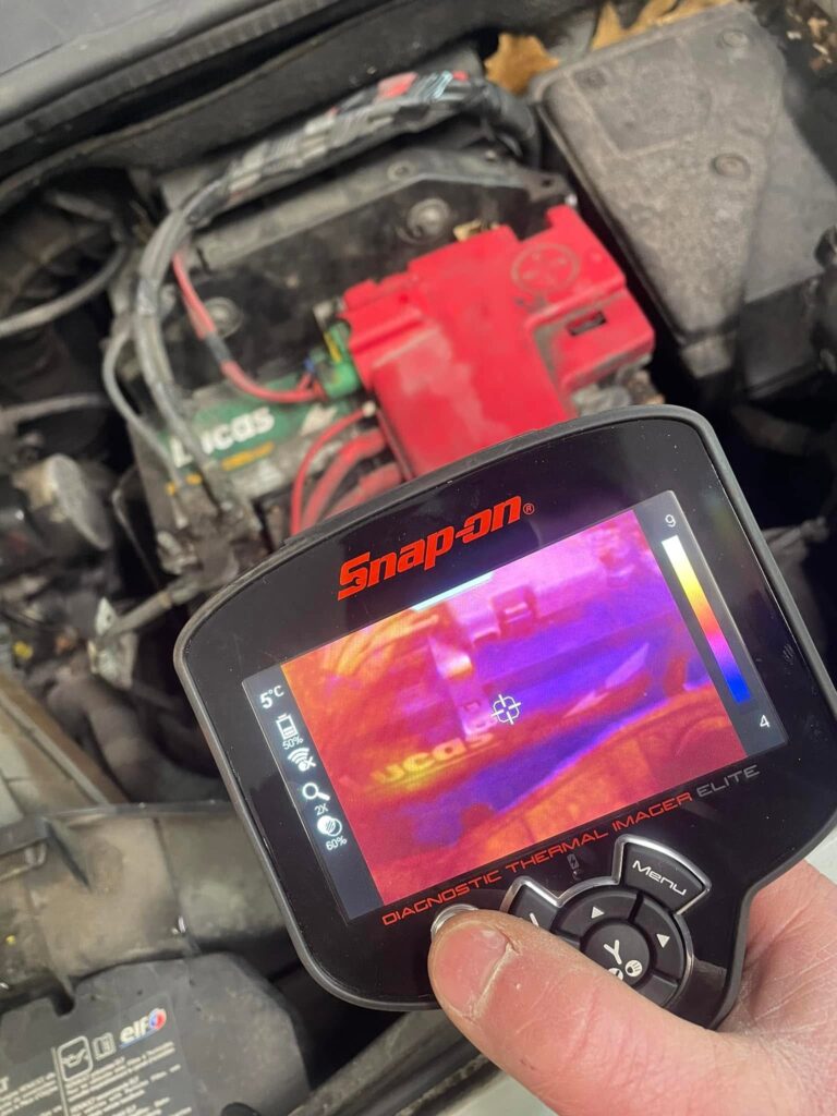 Thermal camera diagnostics on a car battery and electrics at Woodside Garage